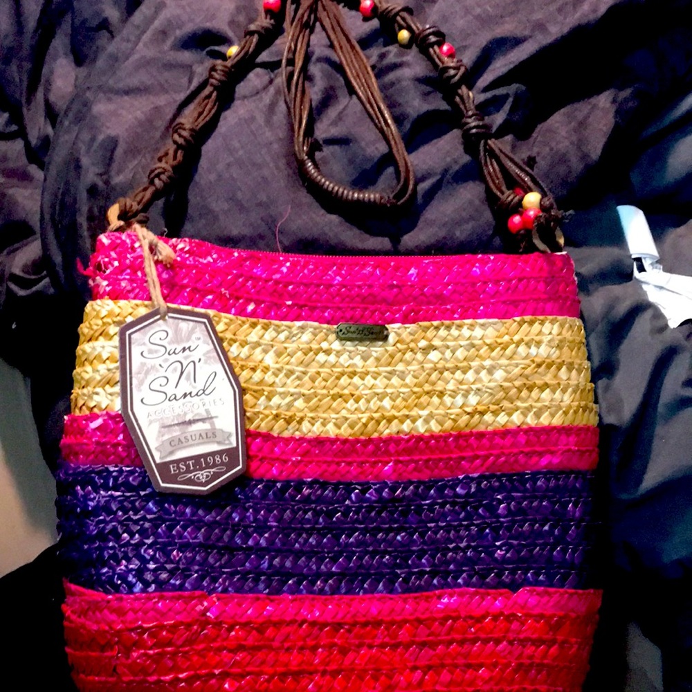 A beautiful bright long strap colorful handbag